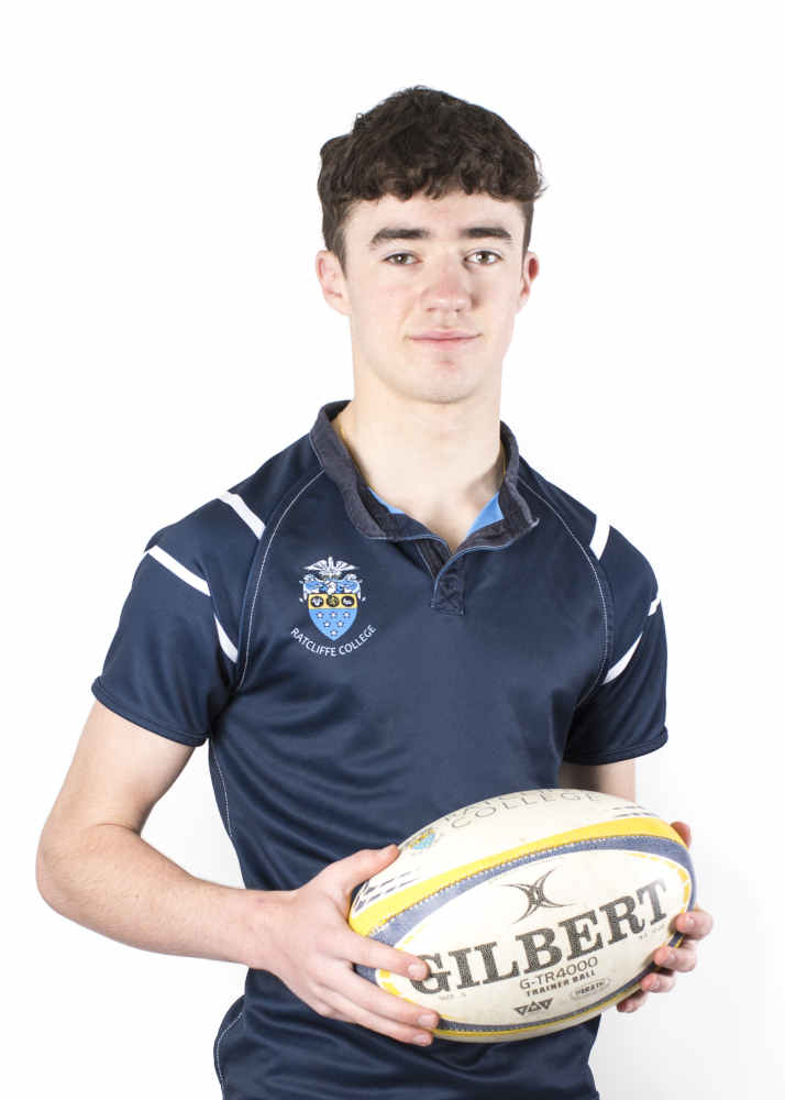 Contact lenses, shown on a teenage boy holding a rugby ball