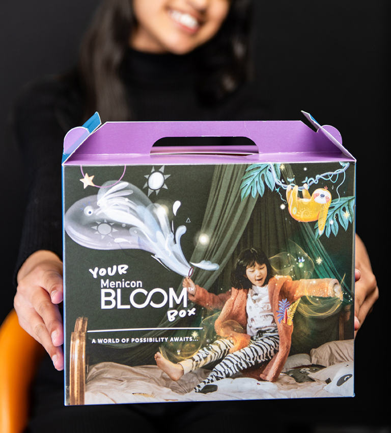 Hands holding a Bloom Box product